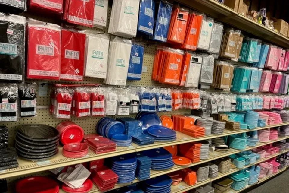 Aisle of party supplies in various colors